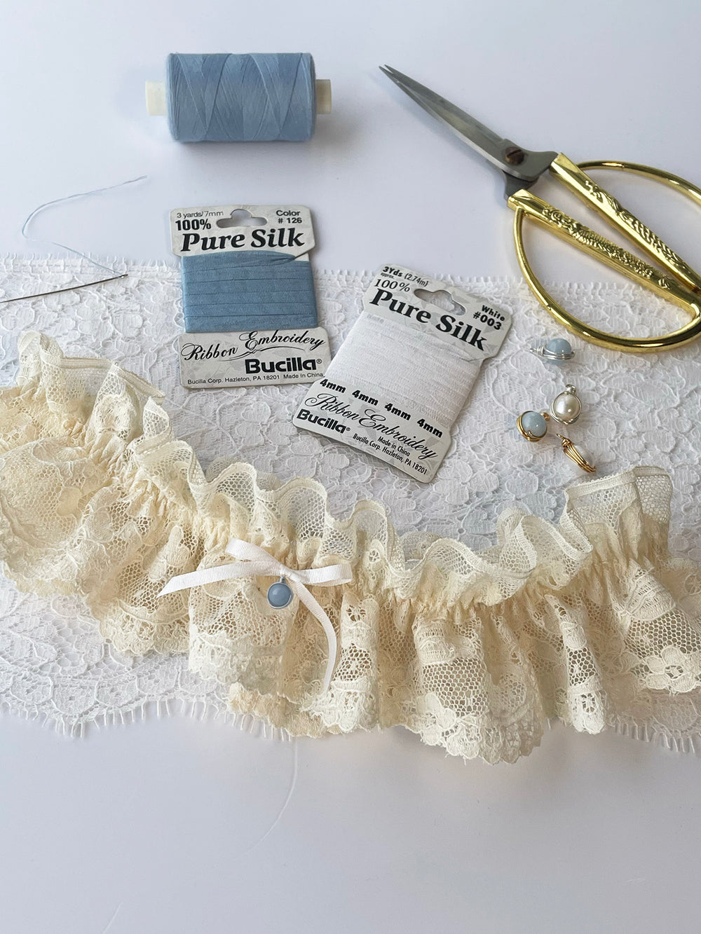 Harper cream lace garter close-up showing handcrafted detail - luxury bridal lingerie Brighton