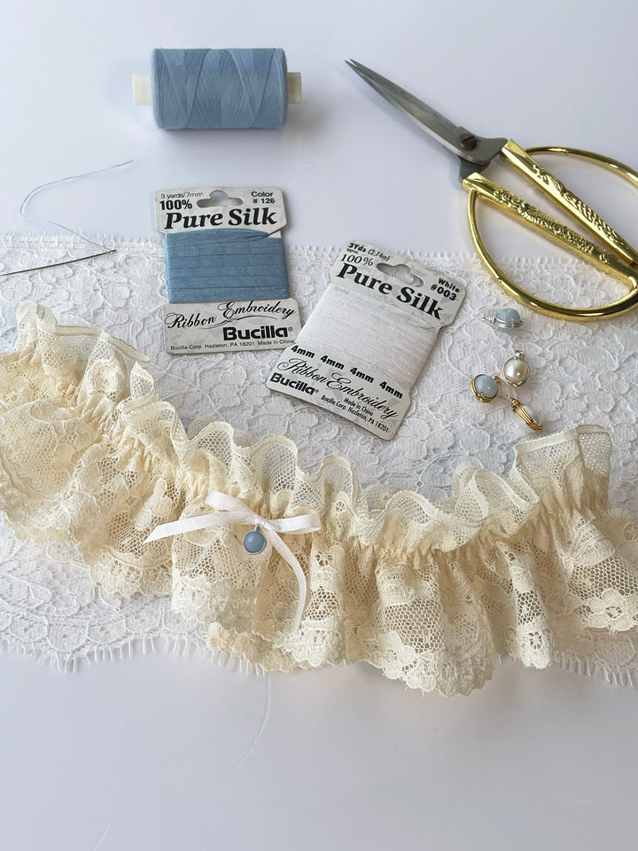 Harper cream lace garter close-up showing handcrafted detail - luxury bridal lingerie Brighton