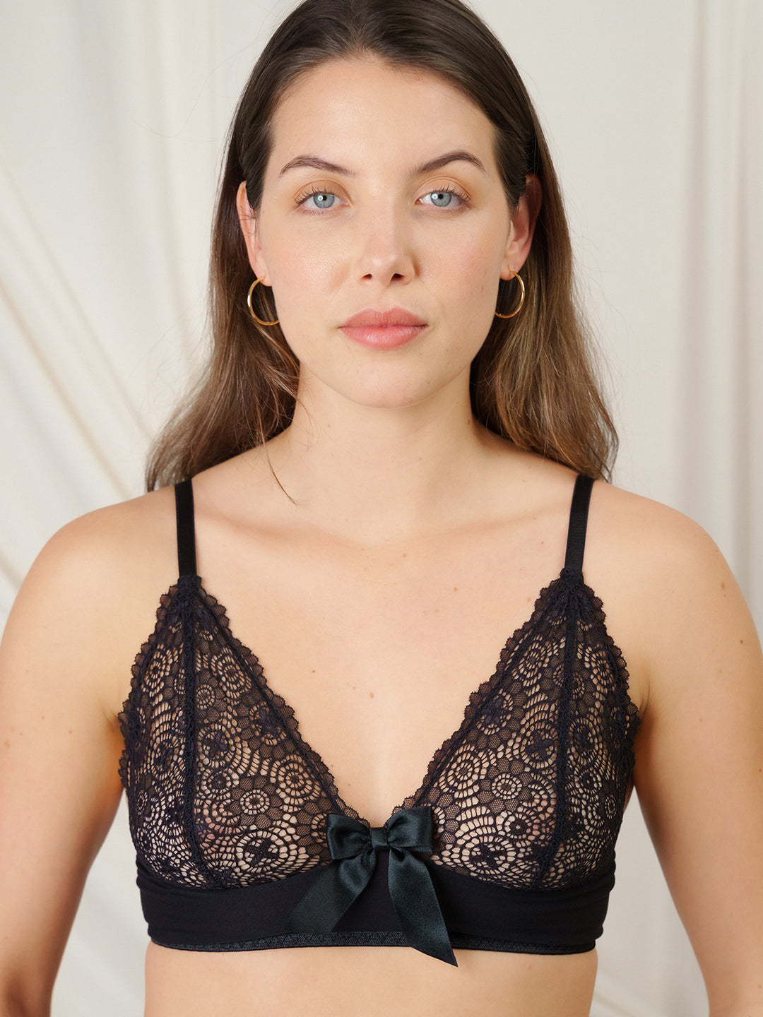 Sustainable black bamboo bralette with lace detail and satin bow - non-wired eco-luxury lingerie