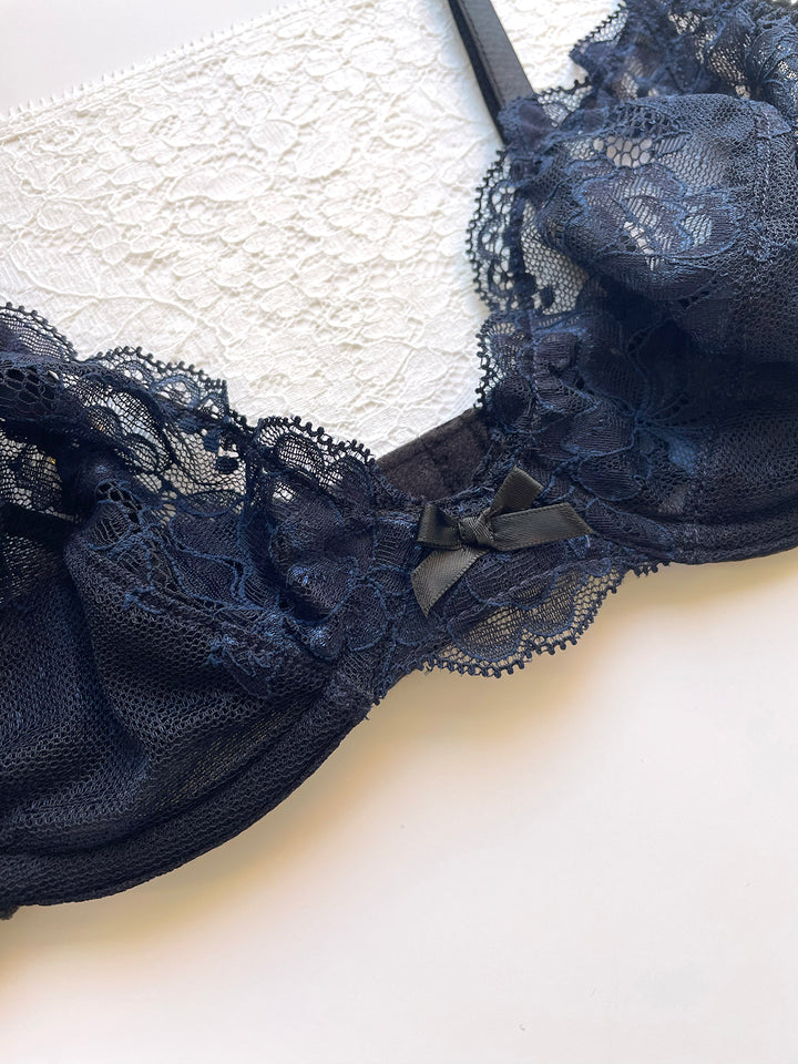 Camilla navy silk plunge bra close-up showing lace cup detail and gold hardware - handmade luxury lingerie Brighton