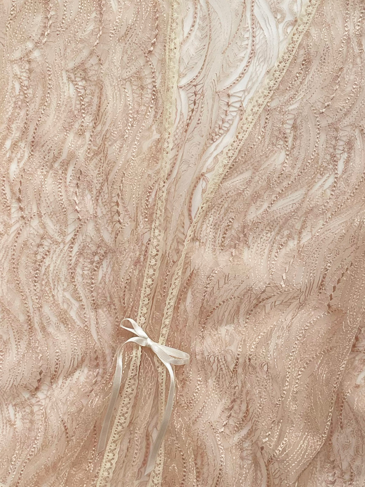Gold Vintage Lace Bed Jacket close up of textured fabric with a ribbon