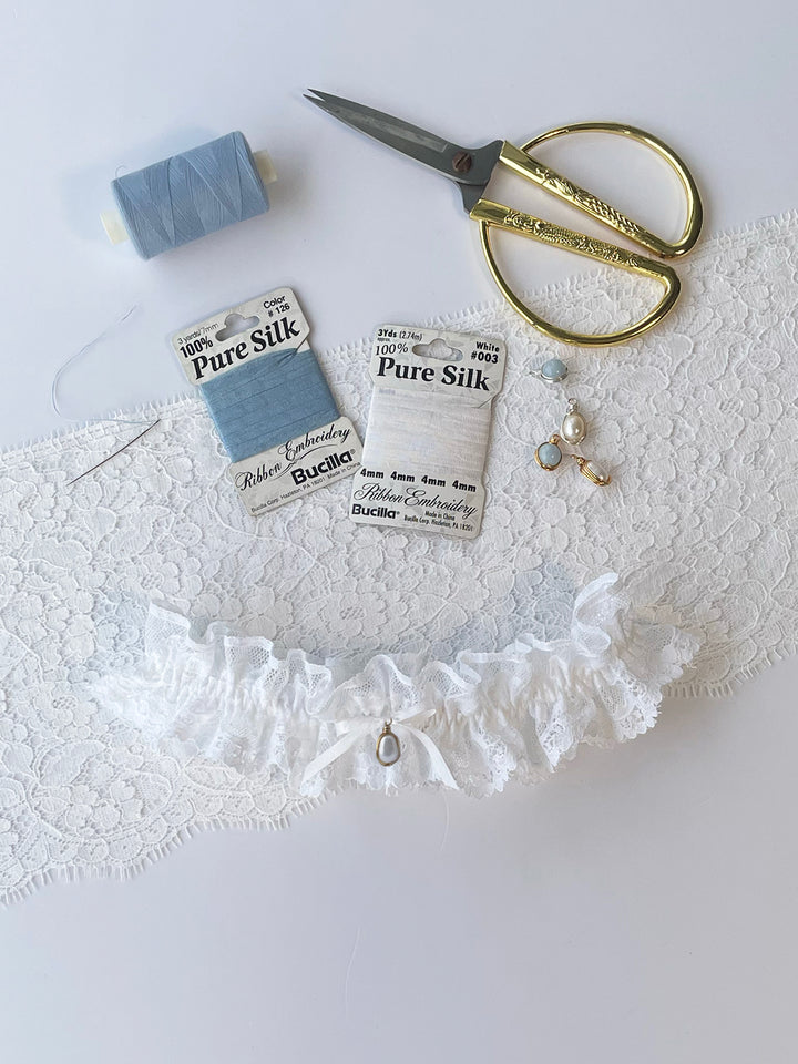 Clara white lace wedding garter with white ribbon and pearl charm - handmade bridal accessory