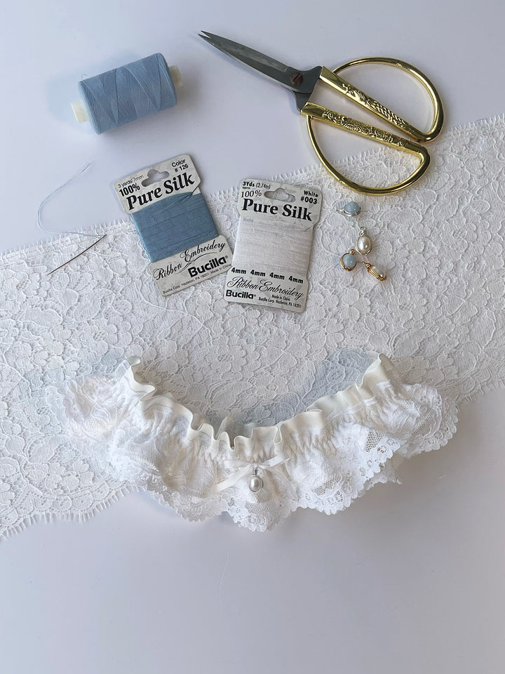 Sophie ivory silk garter with handmade pearl pendant and white satin bow - luxury bridal accessory