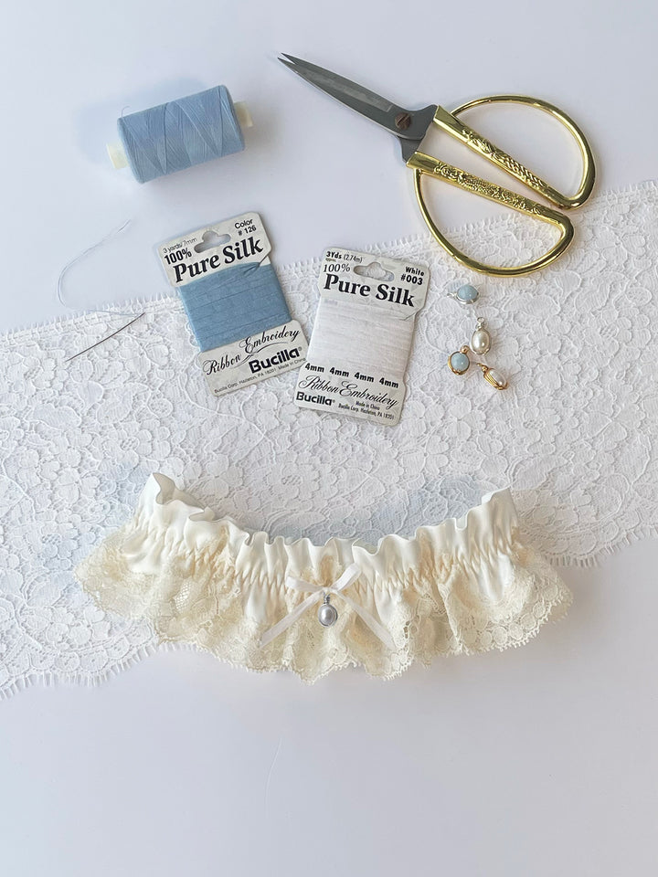 Harper ivory silk wedding garter with white bow - handmade bridal lingerie with pearl pendant