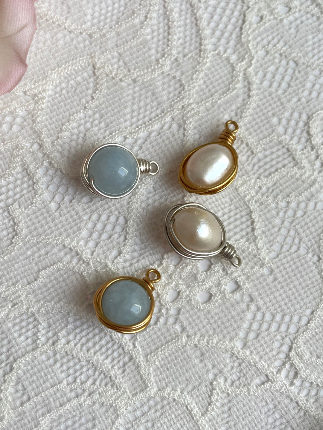 Handmade wire wrapped pearl and aquamarine pendants 